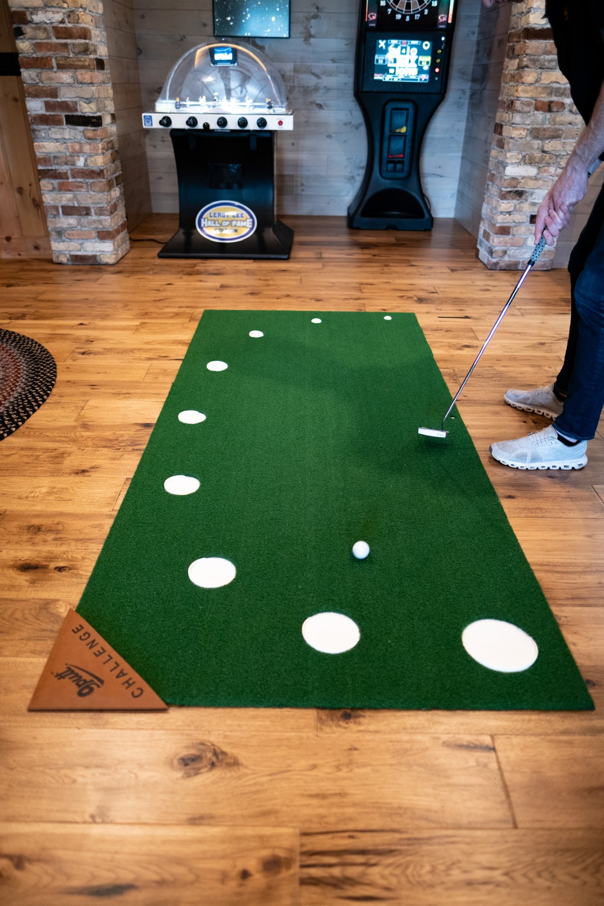 9Putt mat with targets labelled 1 through 9, from the large front cup to the smallest back cup